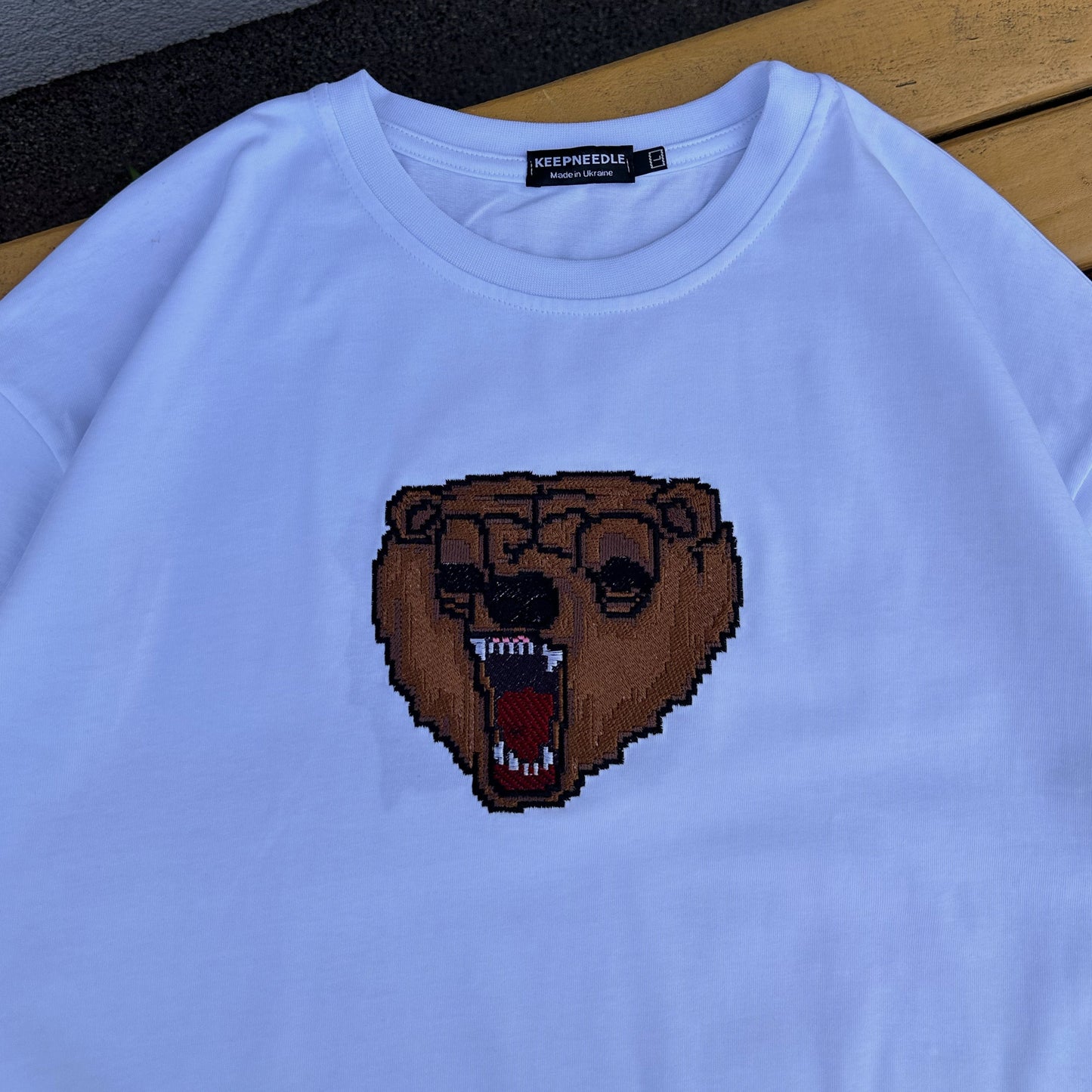 Mark tee