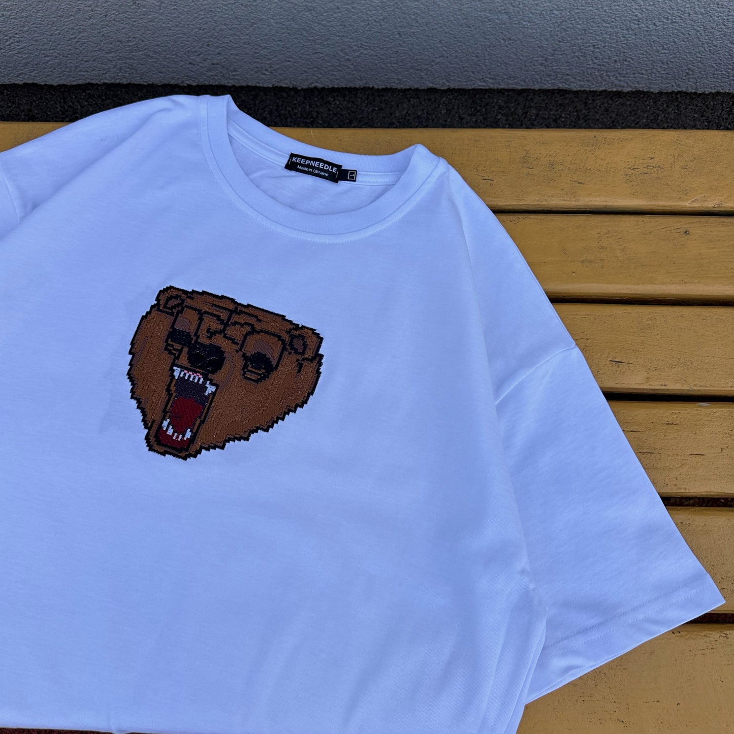 Mark tee